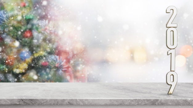 Sobremesa de piedra de mármol blanca en la falta de definición con el fondo del árbol de navidad del bokeh.