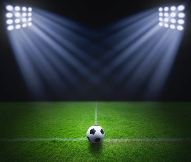 Soccer ball on the green grass 