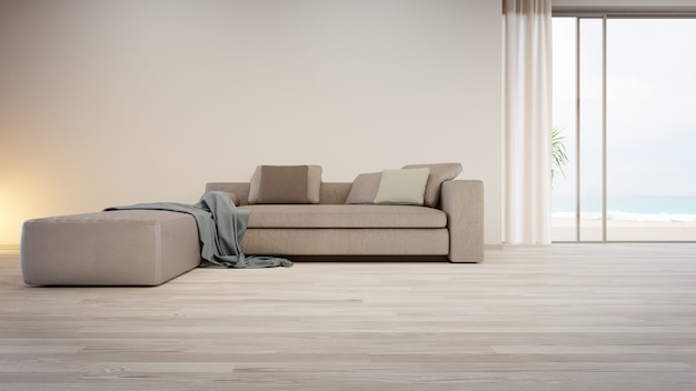 Sofá cinza perto de uma parede em branco no chão de madeira vazio da grande sala de estar em uma casa moderna ou villa de luxo