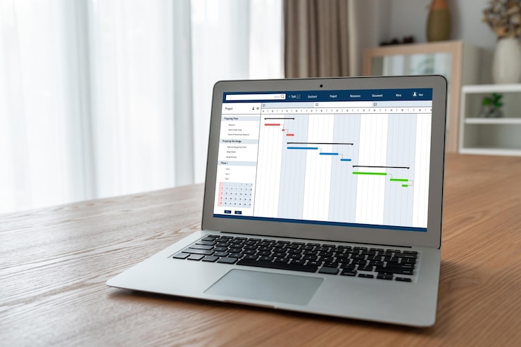 Foto software de planificación de proyectos para la gestión de proyectos empresariales modish en la pantalla de la computadora que muestra el gráfico de línea de tiempo del proyecto del equipo