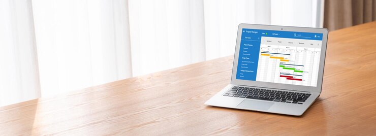 Foto software de planificación de proyectos para la gestión de proyectos empresariales modish en la pantalla de la computadora que muestra el gráfico de línea de tiempo del proyecto del equipo