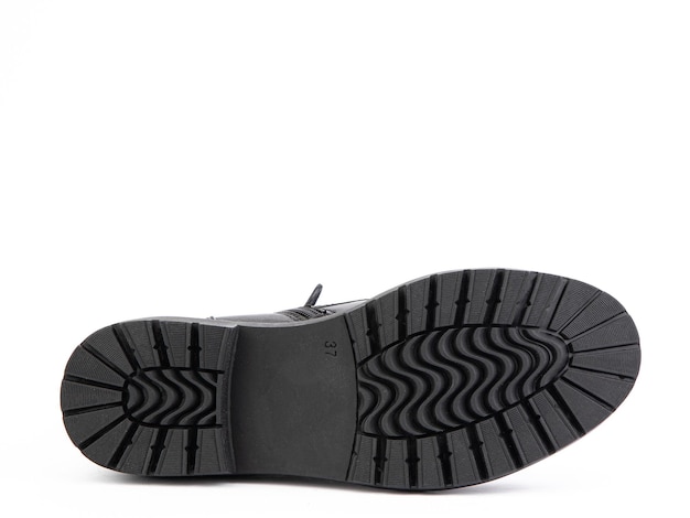 Sola para vista inferior de sapatos Closeup de sola de sapato isolado no fundo branco lugar para texto Elemento de botas Conceito de produção de sapato