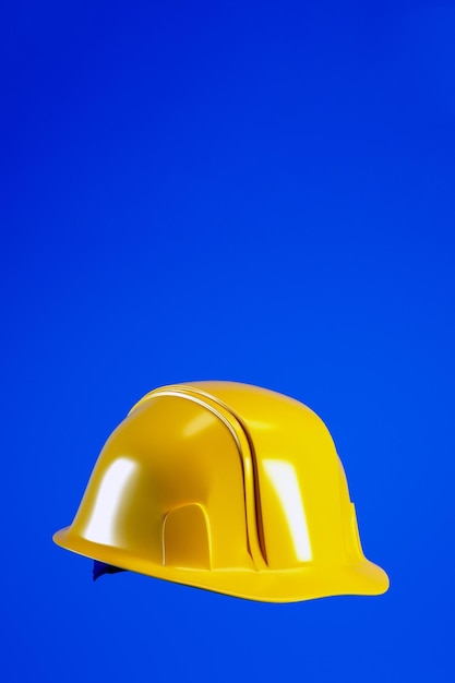 Foto sombrero duro para el concepto del día del trabajo casco amarillo aislado en fondo vertical azul renderizado en 3d