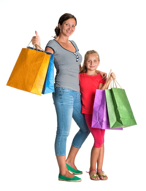 Sonriente, madre e hija, con, bolsas de compras