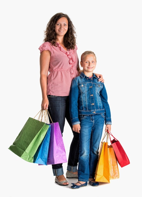 Sonriente, madre e hija, con, bolsas de compras