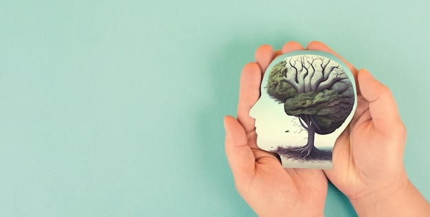 Foto sostener el árbol del cerebro humano en las manos autocuidado y concepto de salud mental crecimiento personal positivo