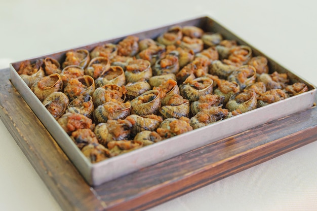 Spanisches Gericht - gebackene Schnecken in Soße