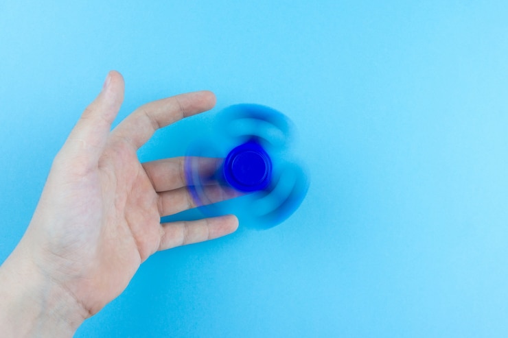 Foto spinner en mano