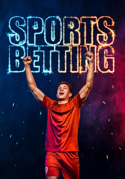 Sportwetten auf Fußball Vertikales Design für einen Buchmacher Laden Sie Banner für eine Sport-Website herunter Fußballspieler Gewinner auf einem feurigen Hintergrund