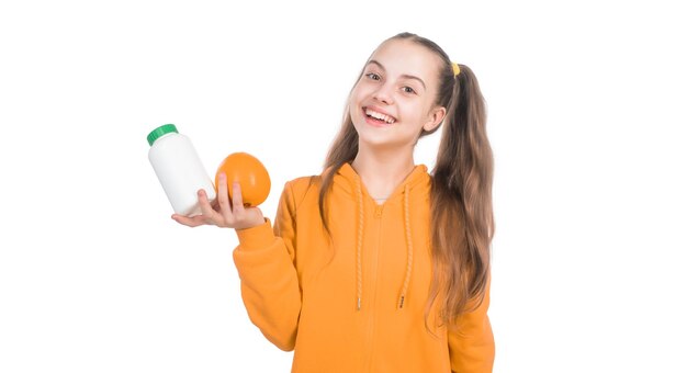 Foto sprühende tablette für kinder glückliches mädchen präsentiert vitamin c organische nahrungsergänzungsmittel