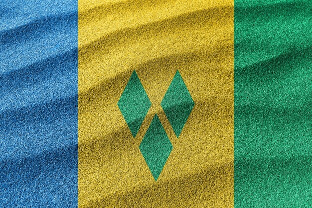 St. Vincent und die Grenadinen Sandflagge Nationalflagge Sandhintergrund