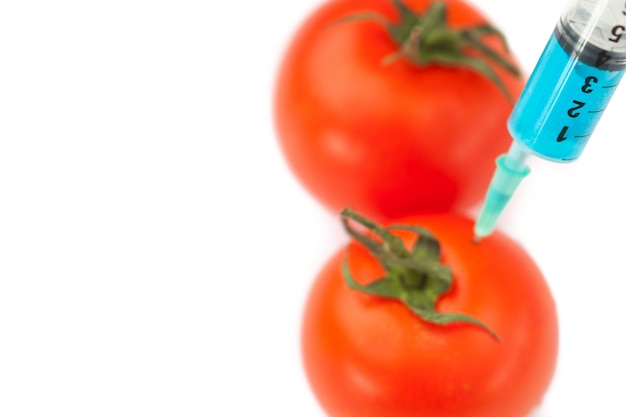 Stechende Tomate der Spritze