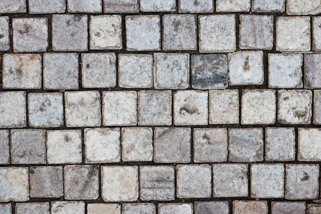 Steinmauer als Hintergrund oder Textur. Ein Beispiel für Mauerwerk als Verkleidung von Außenwänden