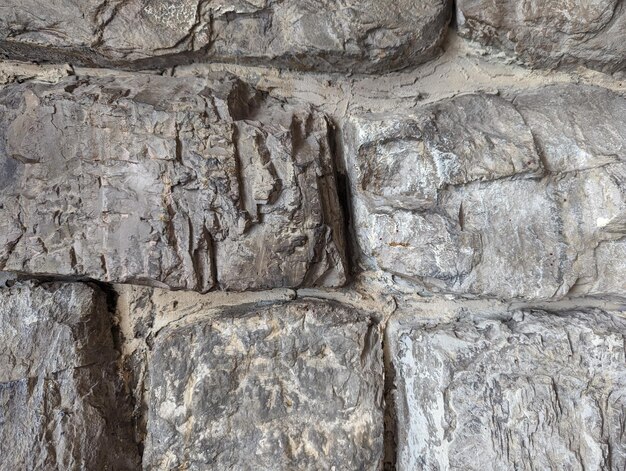 Foto steinmauer aus quadratischen grauen steinen