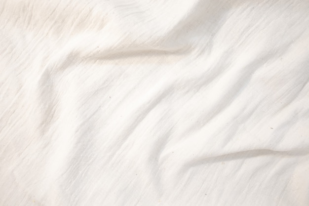Stoffhintergrund Weißes Leinen Leinwand zerknittert natürlicher Baumwollstoff Natürliches handgemachtes Leinen Draufsicht Hintergrund Organische Öko-Textilien Weißer Stoff Leinen Textur
