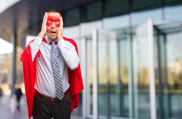 Stressed super businessman posing