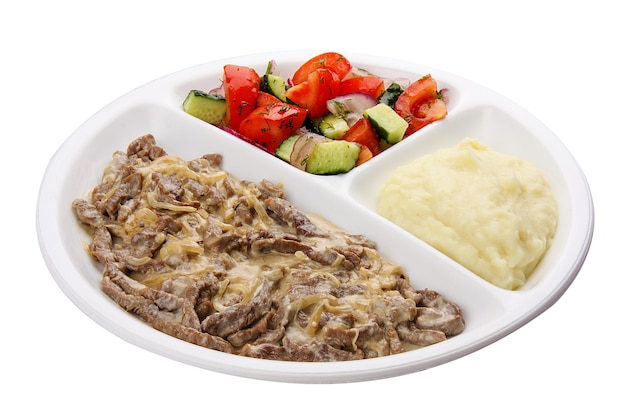 Foto strogonoff de carne com purê de batata e legumes refeições para crianças
