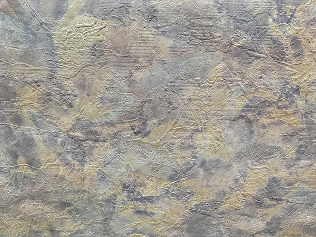 Struktur des abstrakten Hintergrunds in Form eines rauen fleckigen Putzes von graubrauner Farbe.