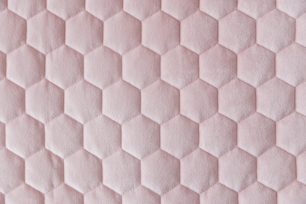 Strukturierter Hintergrund aus rosafarbenem Hexagon-Mesh-Gewebe