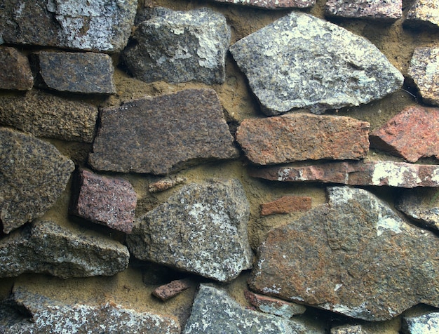 Strukturierter Hintergrund der Steinmauer