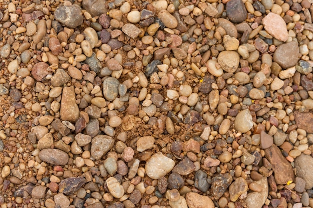 strukturierter Hintergrund von Steinen und Flusssand