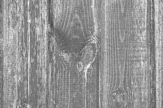 Strukturierter Holzzaun mit grauem Rindenholzhintergrund der rustikalen Planke,