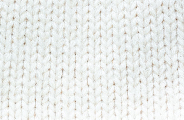 Strukturierter weißer Makro-PulloverTextur aus Wolle Weißer Hintergrund für Bildschirmschoner Stricken mit