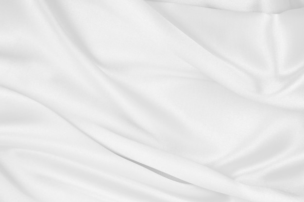 Suave seda blanca elegante o textura de tela satinada de lujo como fondo de boda