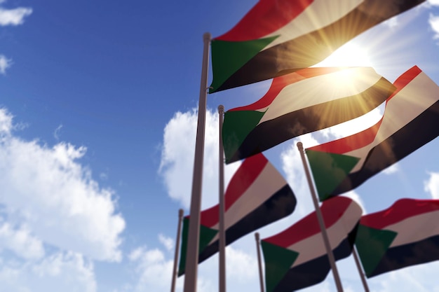Sudan-Flaggen wehen im Wind gegen einen blauen Himmel d-Rendering