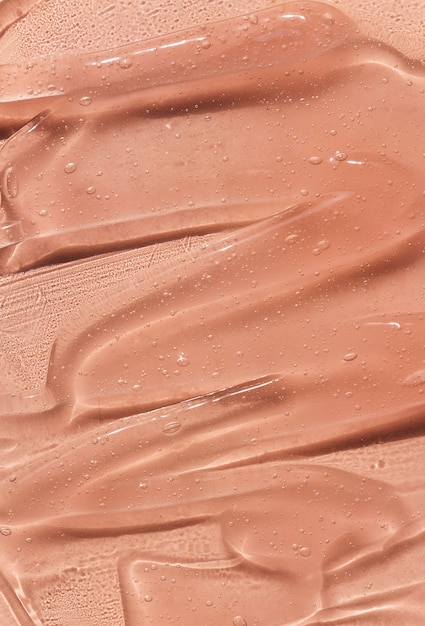 Foto suero de belleza gel textura crema clara para el cuidado de la piel con fondo de burbujas