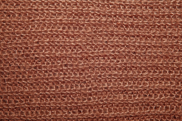 Suéter marrom de fios tecidos fofos como pano de fundo