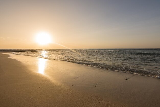 Sunrise_at_the_wet_sandy_beach_with_waves_at_the_sea_in_egyp