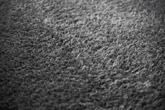 Superficie de alfombra de tela suave gris Fondo de textura gris de la alfombra peluda