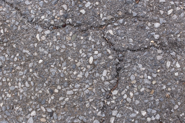 superficie de la carretera de asfalto con fondo de textura de grietas