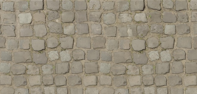 Superfície da estrada feita de pedras quadradas calçada de cascalho Detalhe de paralelepípedos na velha estrada Velha