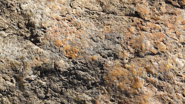 Superfície de granito. Textura de pedra de granito. Superfície de pedra natural rachada. Copie o espaço