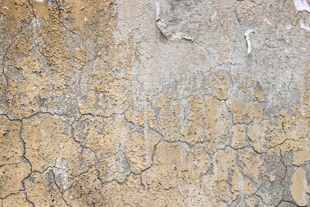 Superfície de parede de concreto velha rachada para fundo de textura