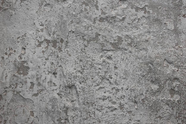 Superfície de pedra desgastada velha com rachaduras Textura aproximada de concreto rachado Fundo cinza vintage Superfície pedregosa ornamental