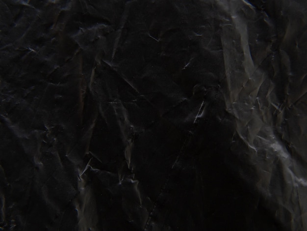 Foto superfície de saco de plástico preto pele irregular e enrugada