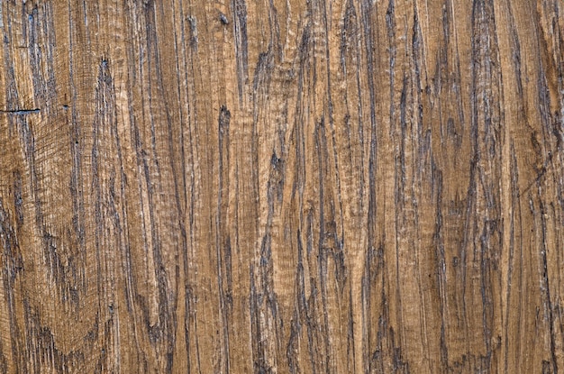 Superficie de fondo en relieve de textura de madera marrón con patrón natural antiguo