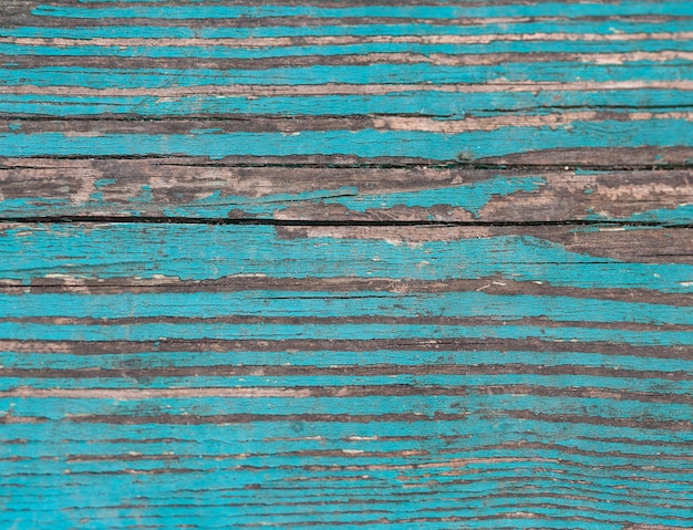 superficie de madera con pintura azul vieja como fondo