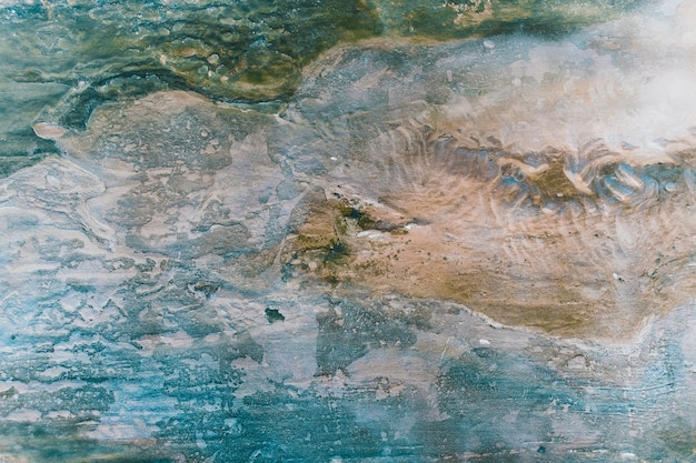 Superficie del mármol con tinte azul y marrón. Fondo de textura de piedra antigua.