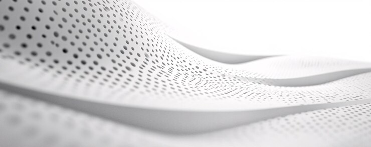 Superficie ondulada blanca que forma un patrón abstracto con agujeros