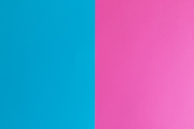 Superficie de papel de color azul y rosa pastel con espacio para texto