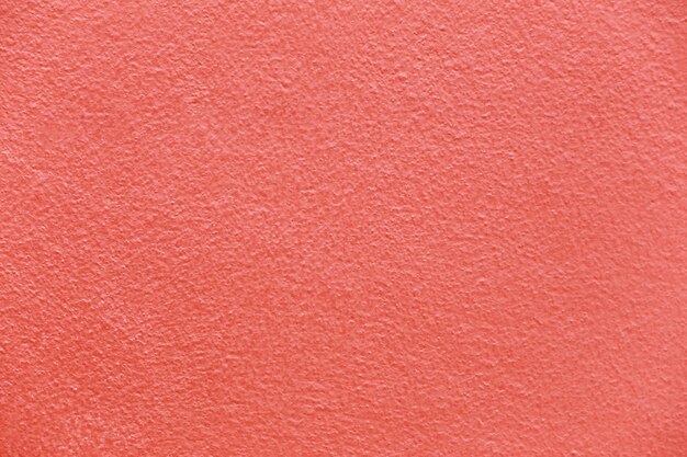 Superficie de la pared de cemento rojo.