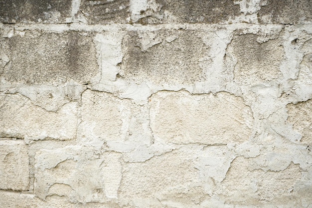 Superficie de pared de piedra real con fondo de piedra de cemento