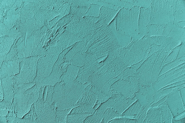 Superficie de pared rugosa pintada de azul