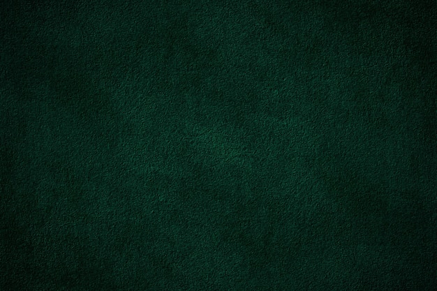 Superficie de pared de yeso de cemento con textura sólida de color verde oscuro para el fondo