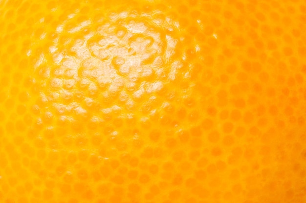 Superficie de piel de naranja primer plano macro vista fondo papel tapiz patrón de textura uniforme