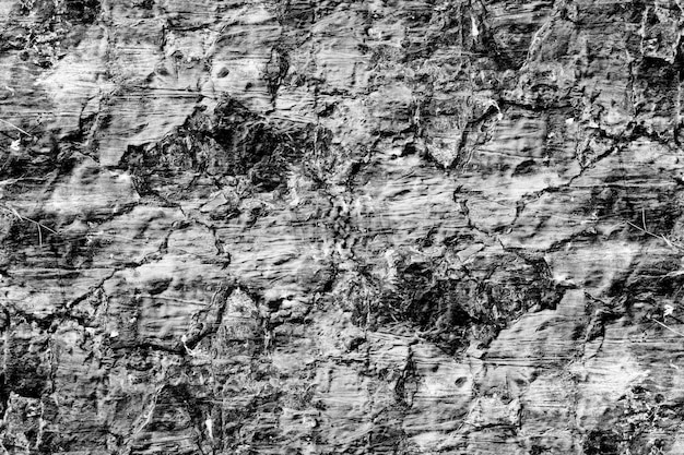Foto superficie rugosa gris oscuro de pared de yeso de cemento abandonada para textura
